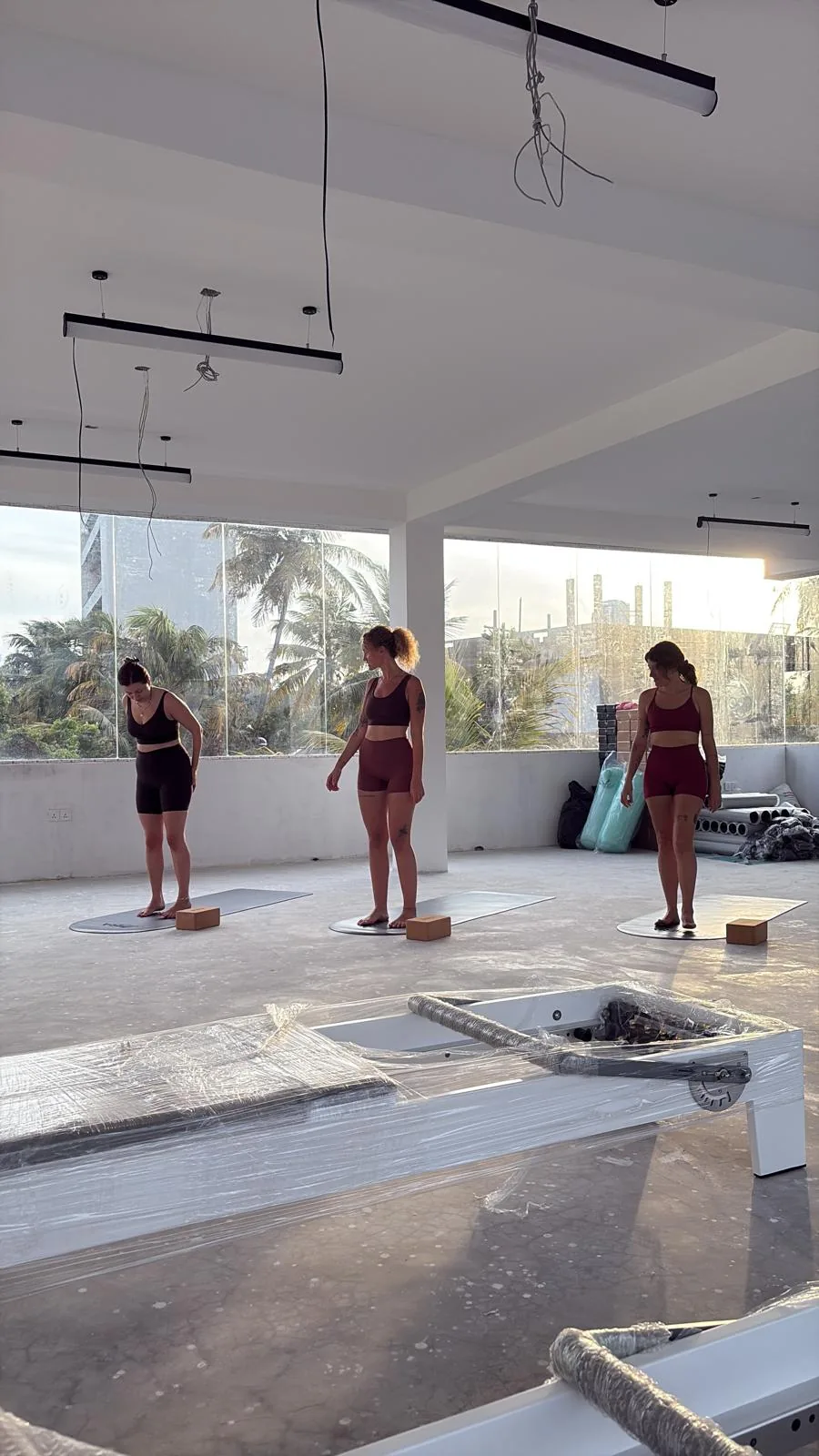 A yoga class in the MiRA Mirissa studio while the reformers were still wrapped in plastic