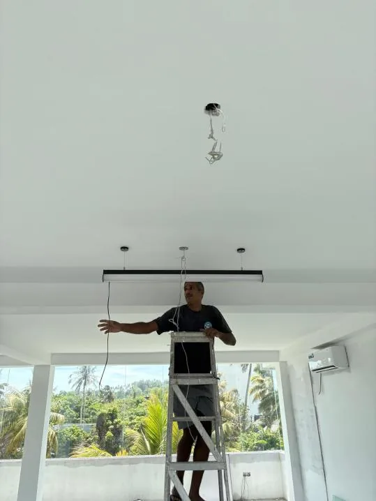 Installing the studio lighting during the MiRA Mirissa fit-out
