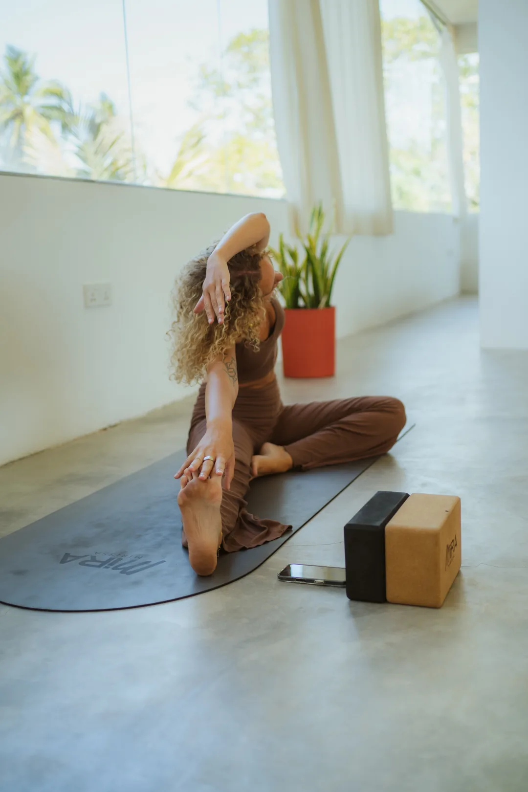 Seated stretch in the air-conditioned studio at MiRA Mirissa, Mirissa, Sri Lanka